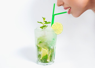 Close up of a woman lips enjoying a tropical mojito cocktail
