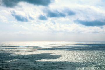 Beautiful seascape in the Atlantic ocean. Seascape with cloudy sky and light shadows on the water