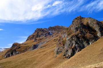 Rocky mountains and blue sky with white clouds