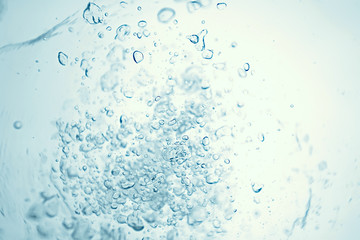 Fototapeta na wymiar underwater air bubbles texture light blue background