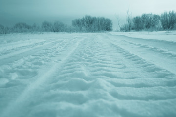 Fototapeta na wymiar winter road snow tracks