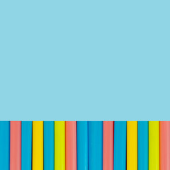 multi  Colorful pipe with copy space for your text on blue background. / education, creativity and feeling happy