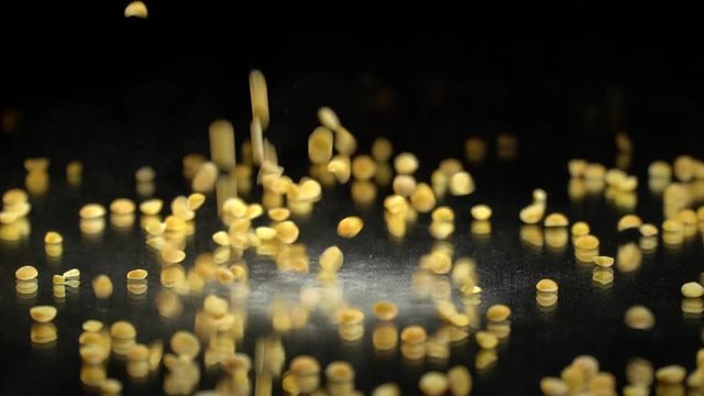 Dried peas are poured onto a mirror table