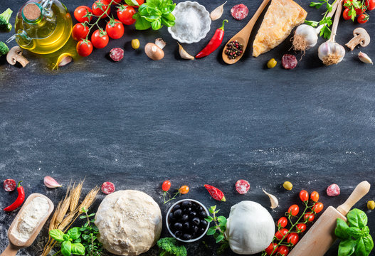 Pizza Ingredients On Black Table In A Raw - Italian Food
