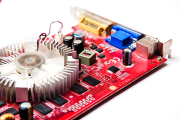 Computer board with capacitors, resistors, transistors and microchips and a heatsink for cooling...