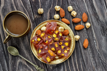 Oriental Arabian sweets with different nuts a cup of coffee. Eastern sweets. Traditional Turkish...