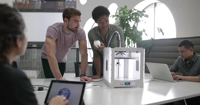Team working with 3D printer