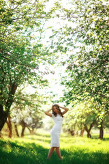 girl spring / portrait of a beautiful girl in a spring blooming park, apple blossoms, beauty, cleanliness, freshness, the smell of spring