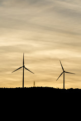 Windmills are producing electric for our world.