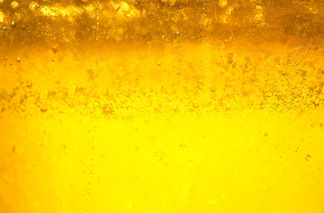 tasty liquid background of fresh Golden honey glistens in the sun