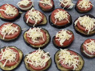 Obraz na płótnie Canvas Eggplant with tomatoes and cheese baked in the oven. 