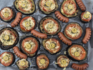 Eggplant with tomatoes and cheese baked in the oven. 