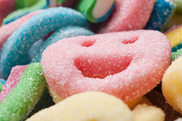 closeup of acidulous  candies in shaped smiley texture