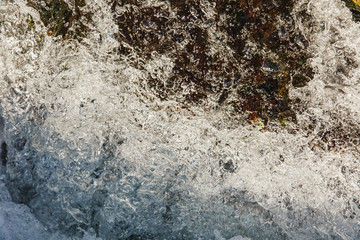 Macro photography Sea waves with foam and spray on stones