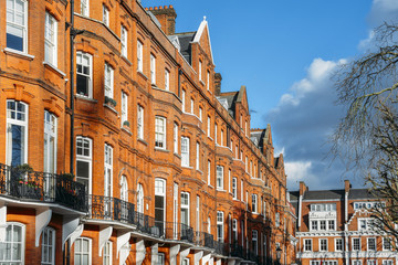Expensive Edwardian block of period red brick apartments typically found in Kensington, West London, UK.