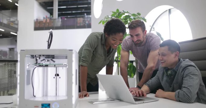 Team working with 3D printer
