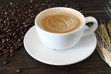 Coffee Cup and Beans on Wooden Table