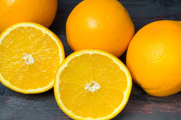 Juicy orange cut in half to make orange juice for Breakfast.
