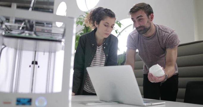 Team working with 3D printer