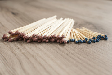 A pile of wooden safety long match sticks on wooden background