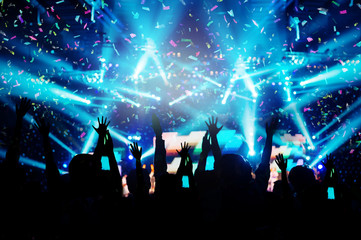 Abstract Party Background - Crowd People Enjoy Dancing and Show Hands Up in the Concert with...