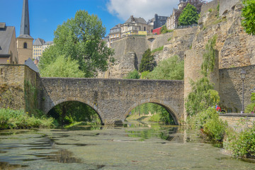 Fototapeta na wymiar old stone bridge and river theme