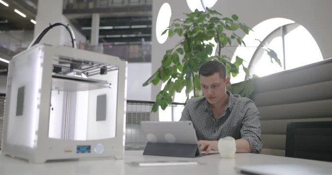 Male working on 3D printer design