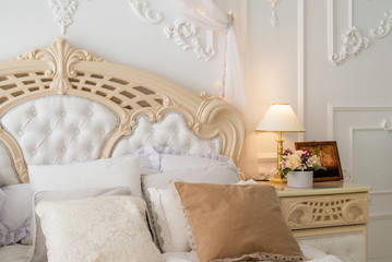 Fototapeta na wymiar Luxury vintage white bedroom