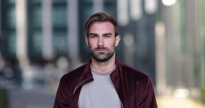Portrait young adult male in city