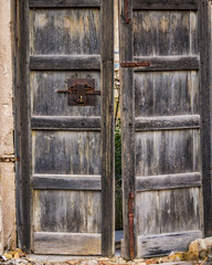This is a old door with a old padlock 