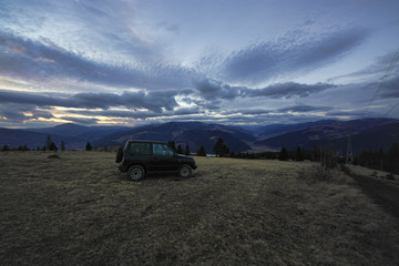 Fototapeta na wymiar off road car in the mountain landscape