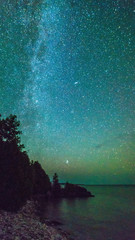Milky way and starry sky along the lakeshore of Georgian Bay at night