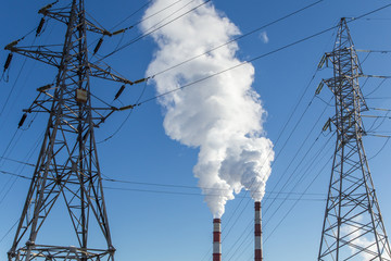 Industrial pipes with smoke and electric main, global warming, air pollution concept