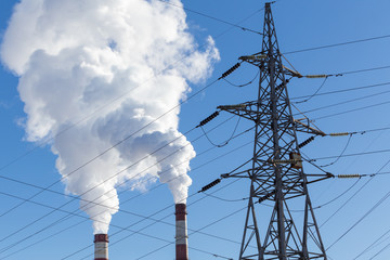 Industrial pipes with smoke and electric line, ecology problem concept