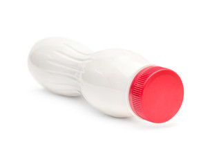 White plastic bottle with red lid on white background.