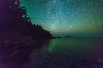 Milky way and starry sky along the lakeshore of Georgian Bay at night