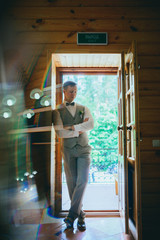 Handsome groom at wedding tuxedo waiting for bride. Rich groom at wedding day