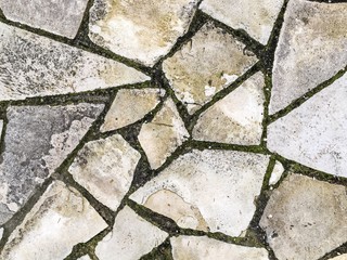 Obraz premium Old weathered stone wall texture. Part of a stone wall, for background or texture