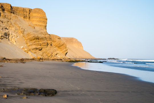 Cliffs by the sea on the coast of Chicama, Peru