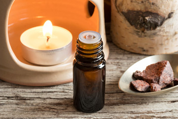 Croton lechleri (sangre de drago) oil with sangre de drago resin in the background