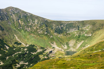 Fototapeta na wymiar Fresh water in the mountains. Mountain Lake.