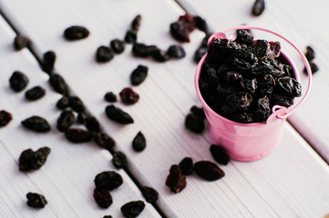 Fototapeta na wymiar raisins on a wooden background