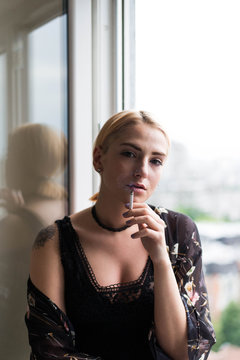 Ginger woman smoking a cigarette