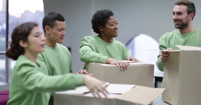 Volunteers sorting clothes donations 