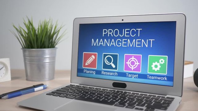 Project management strategies showing on a laptop computer screen sitting on a desk. Camera is slowly turning around the computer.