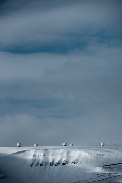 Radar domes on a snow covered mountain