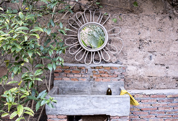 Wire Flower Mirror over Basin Outdoors