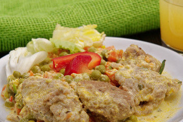 Stewed vegetables with oatmeal dumplings on a table