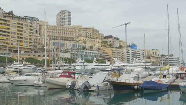 Pan left of boats in the harbor of Monaco