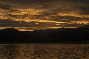 Sunset on the lake mountains
